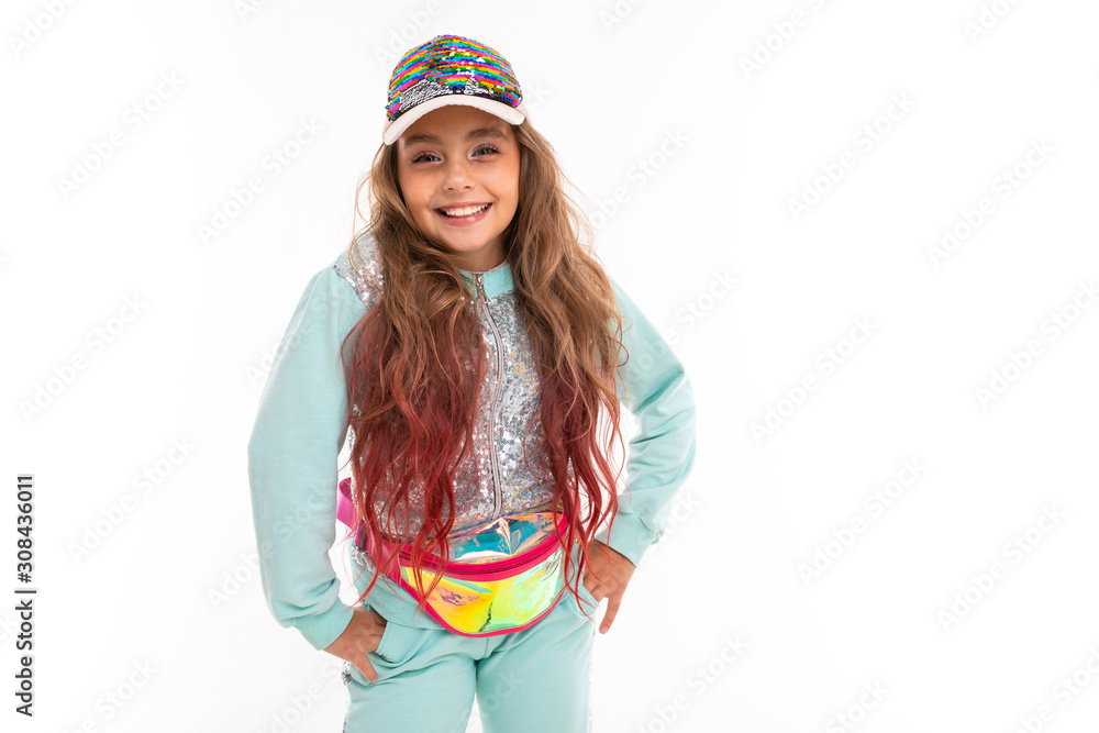 Little pretty caucasian girl in a tracksuit, picture isolated on white background Little pretty caucasian girl in a tracksuit, picture isolated on white background