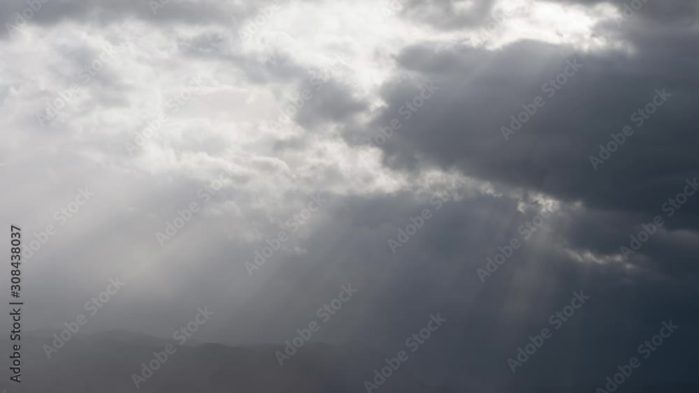 time lapse of Sun rays throughclouds on overcast autumn day time lapse of Sun rays throughclouds on overcast autumn day