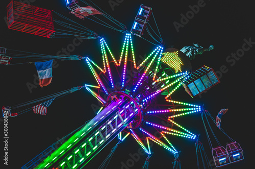 Amusement park fun fair ride with multi colored led lights