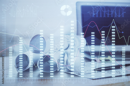 Financial market graph hologram and personal computer on background. Multi exposure. Concept of forex. © peshkova