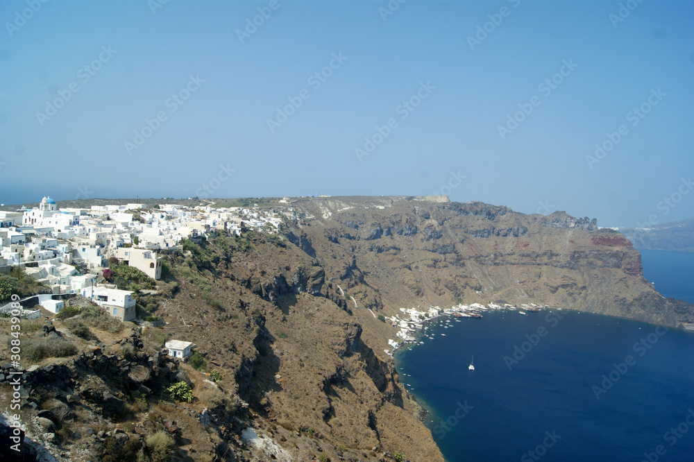 Greece, Thirasia island.  A lesser known hidden gem. Much quieter than the well know adjacent island of Santorini.  A view of the capital, Manolas, atop imposing,  spectacular, cliffs.