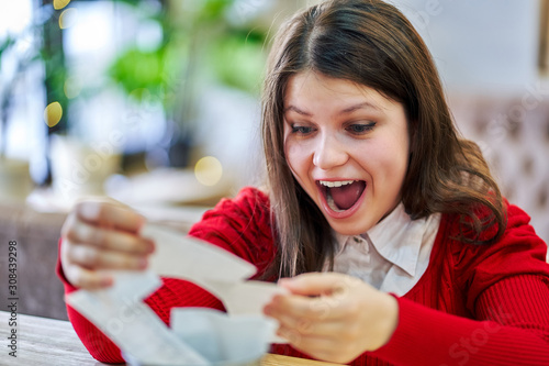 happy woman won a prize in the lottery