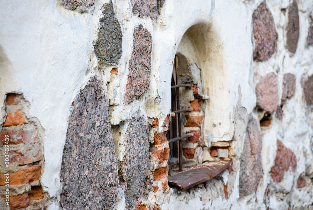 Window on the wall of an ancient building Window on the wall of an ancient building