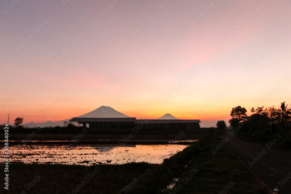 the beauty of the sunset with beauty reflection of mountains in Magelang, Central Java / Indonesia