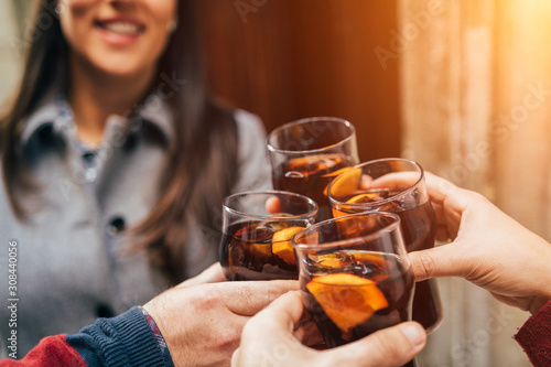Papier peint Cheers! Group of friends enjoying a vermouth in bar or pub - Young people hands