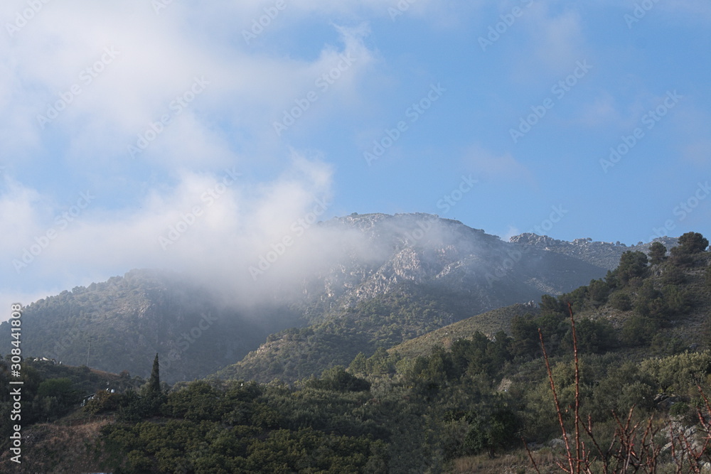 Landscape with clouds in southern Spain, near the mountain village of Frigiliana on the Costa del Sol..  Copy space.