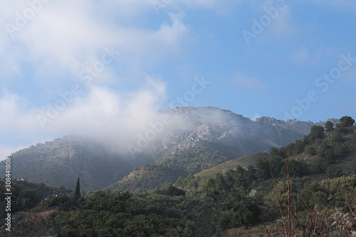 Landscape with clouds in southern Spain, near the mountain village of Frigiliana on the Costa del Sol.. Copy space.