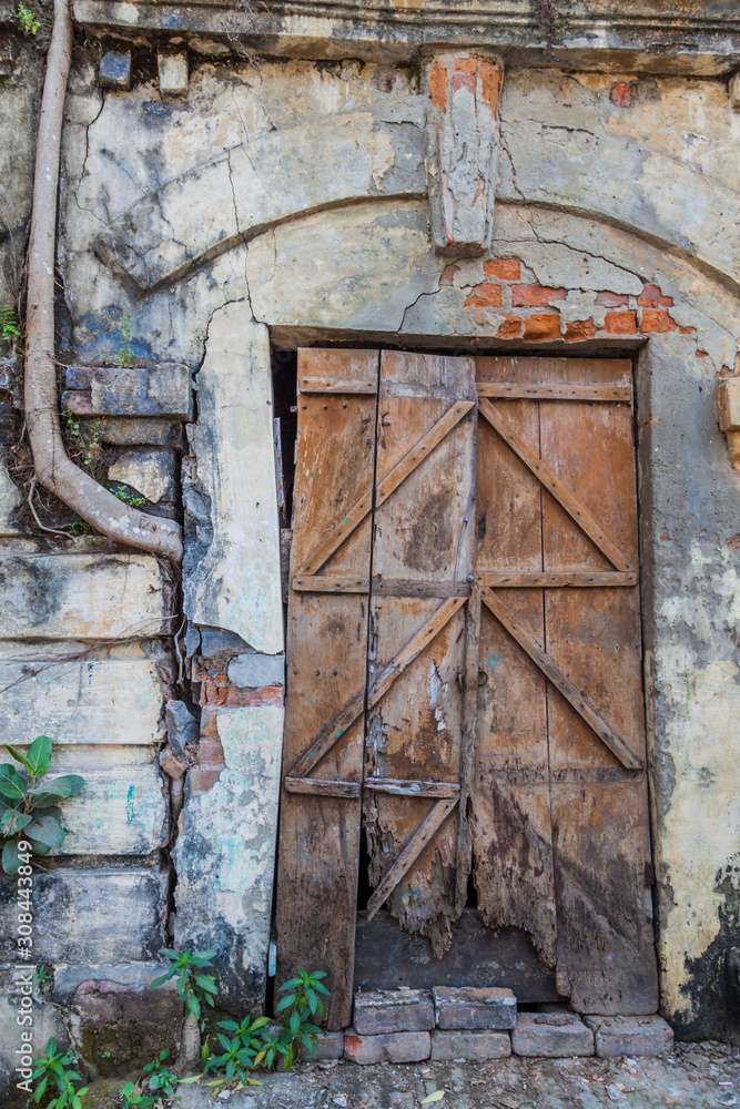 Door of an old dilapidated house in Khulna, Bangladesh