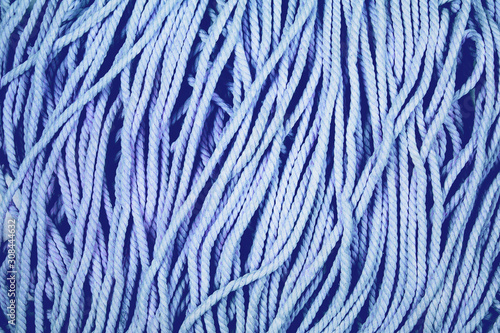 Minimalistic cotton blue rope background with texture and contrast.