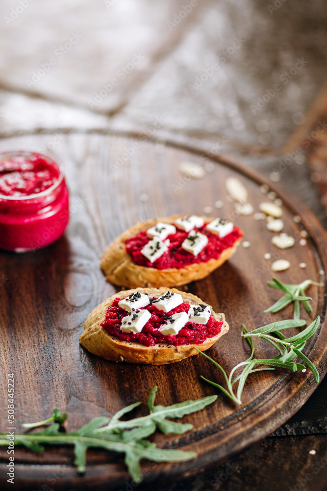 Canapes with horseradish and feta cheese sprinkled with sesame seeds. Appetizer for strong alcohol Canapes with horseradish and feta cheese sprinkled with sesame seeds. Appetizer for strong alcohol