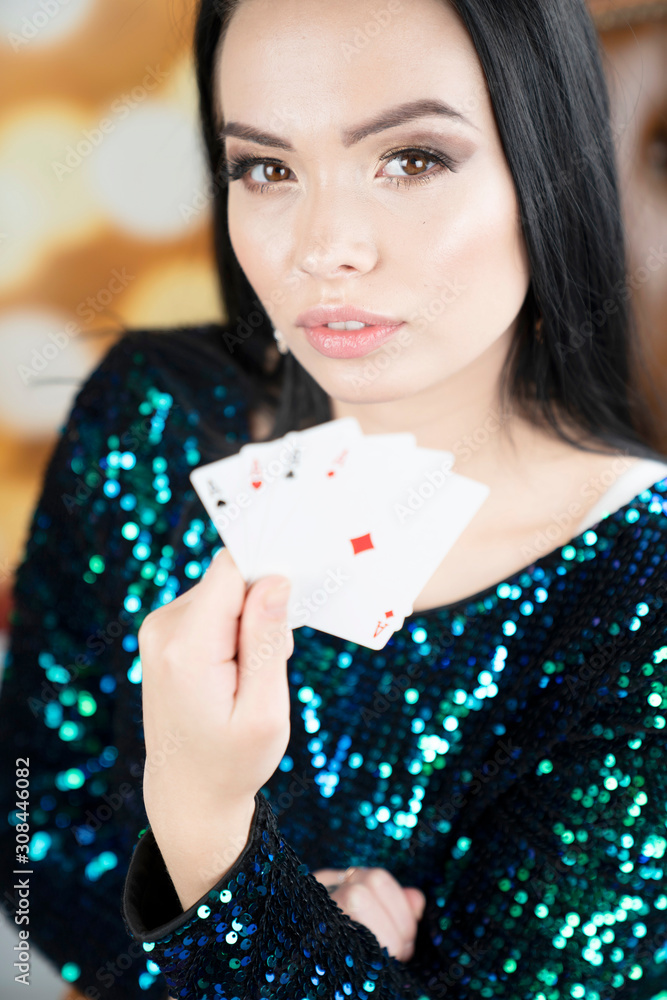 Casino. Portrait of pretty young woman holding playing cadrs in her hand. Casino. Portrait of pretty young woman holding playing cadrs in her hand.