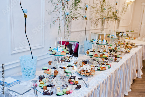 Dessert table of delicious sweets on wedding reception. © AS Photo Family