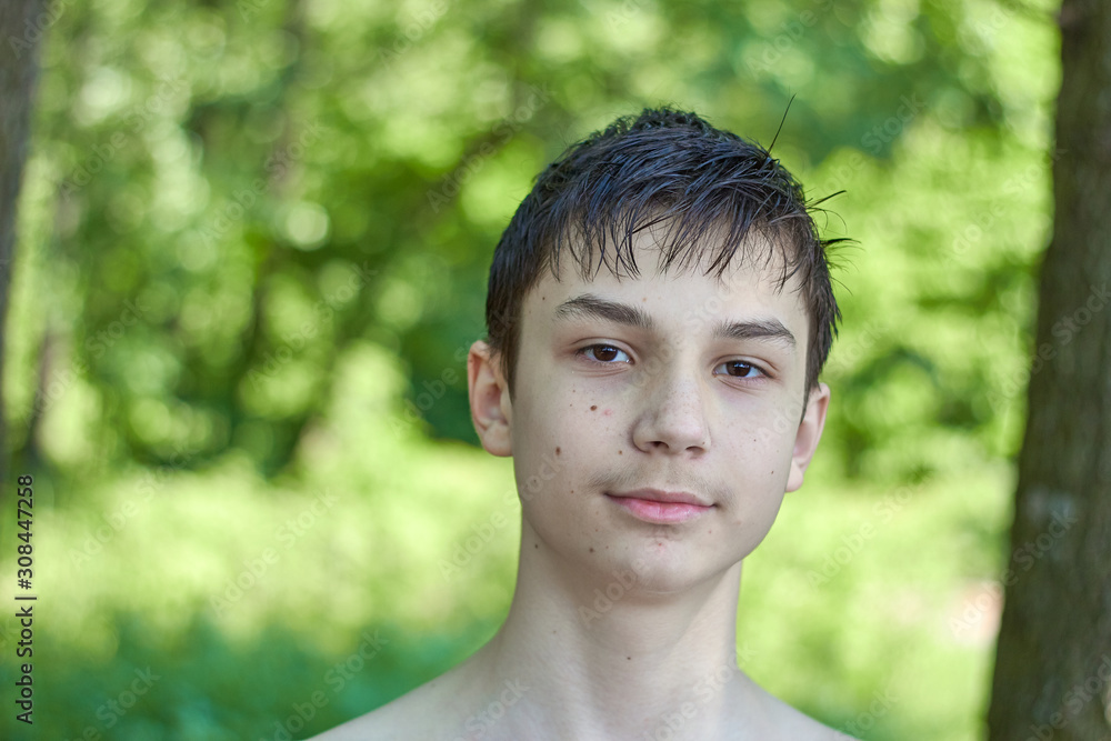 Portrait happy teenager on the nature background Portrait happy teenager on the nature background