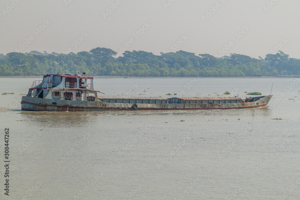 Rusty cargo ship on Pangunchi river, Bangladesh