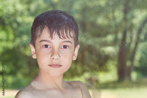 Portrait of young boy in nature  park or outdoors