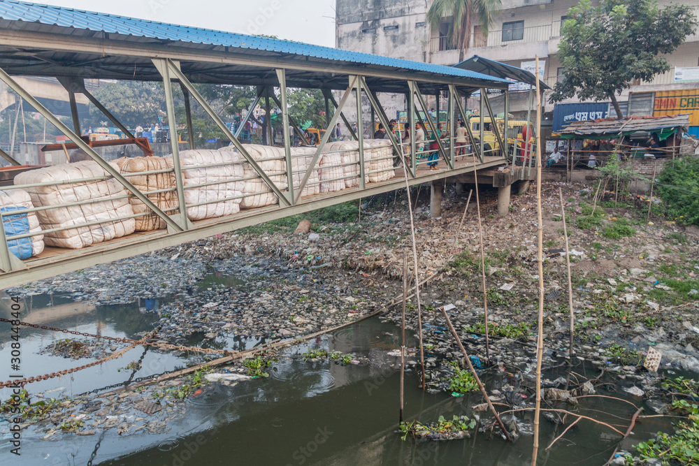 Fototapeta premium DHAKA, BANGLADESH - NOVEMBER 20, 2016: Landing bridge for passenger boats at Badamtoli Boat Terminal at Buriganga river in Dhaka, Bangladesh