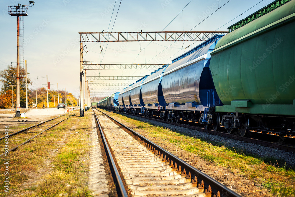 long green train with new wagons with grain stands at the station long green train with new wagons with grain stands at the station