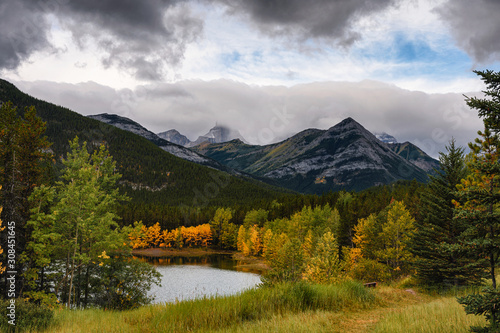 Rocky mountain in autumn forest on gloomy day