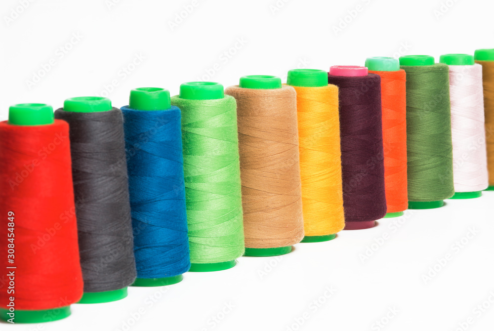 Colorful bobbin thread isolated on white background. Colorful bobbin thread isolated on white background.