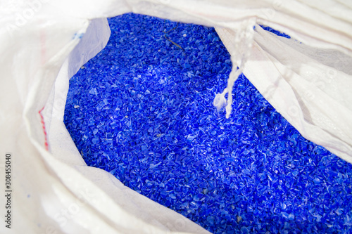 Blue plastic polymer pellets in the bag