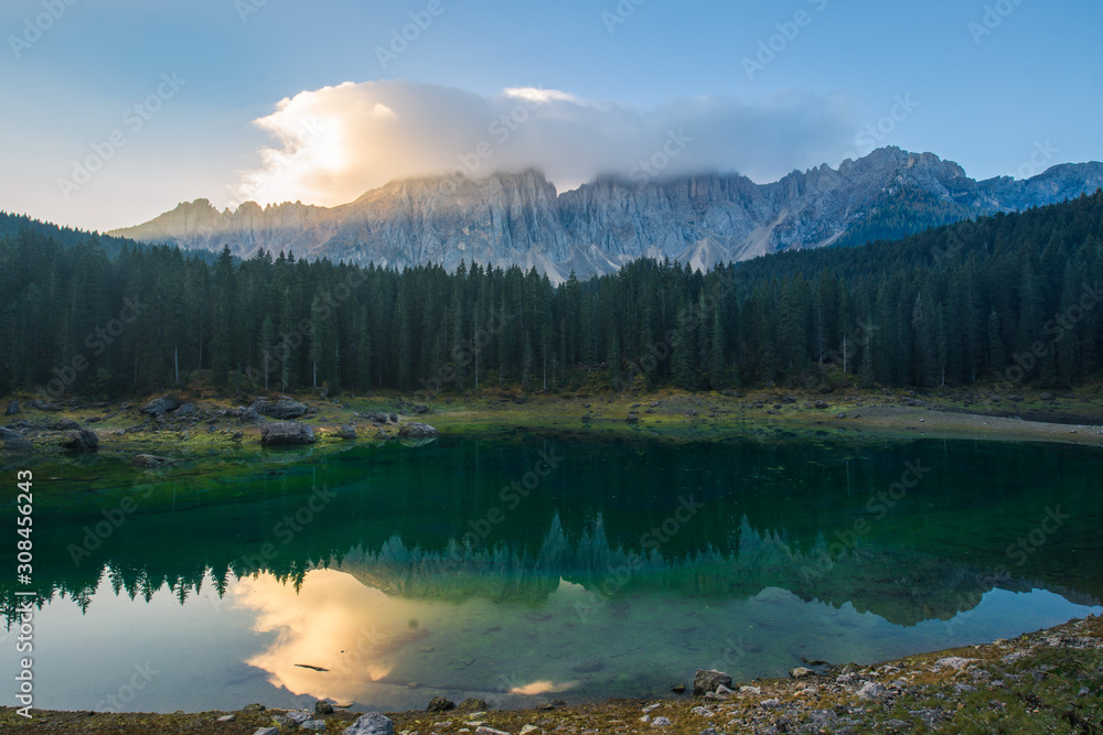 Sunrise landscapes in Lago di Carezza and Latemar Mountain in the background in Welschnofen, South Tyrol, Italy