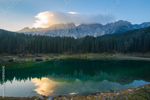 Sunrise landscapes in Lago di Carezza and Latemar Mountain in the background in Welschnofen, South Tyrol, Italy