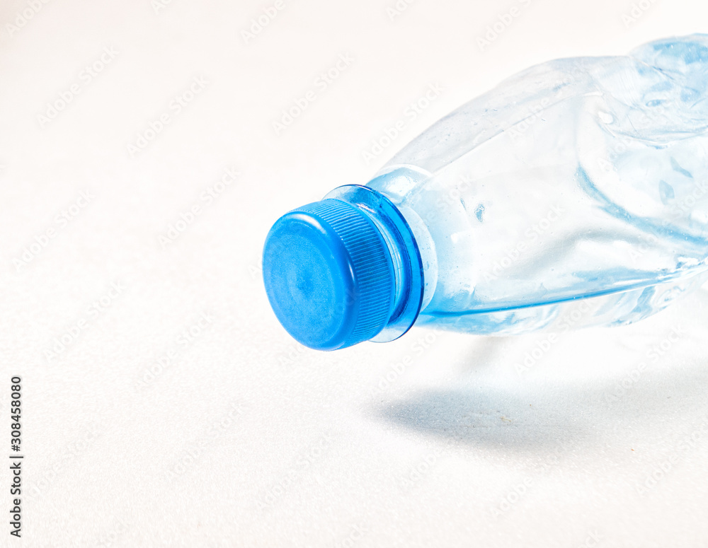 bottle of water with blue cap on white bottle of water with blue cap on white