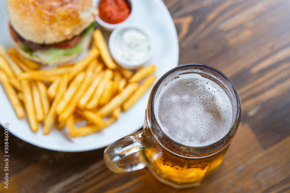 cold beer and delicious hamburger cold beer and delicious hamburger