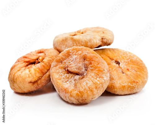 Heap of dried figs isolated on a white background.