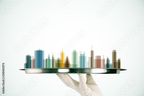 Hand holding plate with smart city