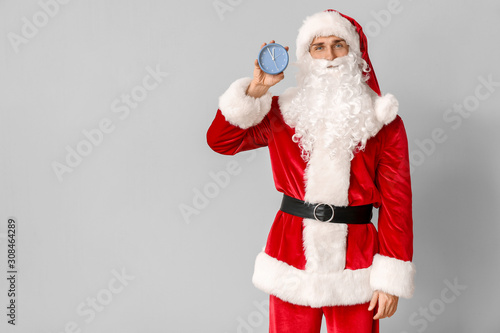 Santa Claus with alarm cloc...