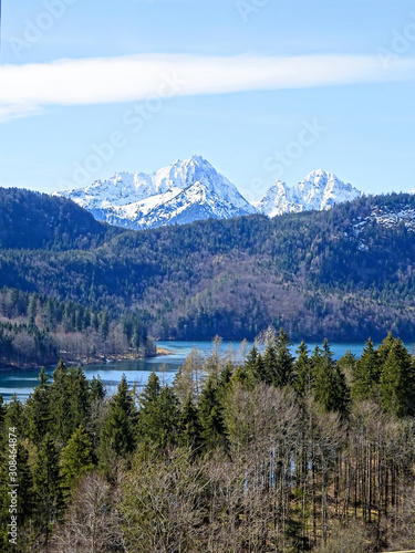 Alpsee lake in surrounded with alpine mountains in Hohenschwangau, Bavaria Germany.