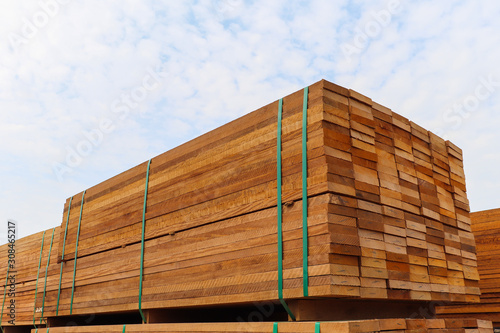 Pallet with a pile of lumber, packed for sale.