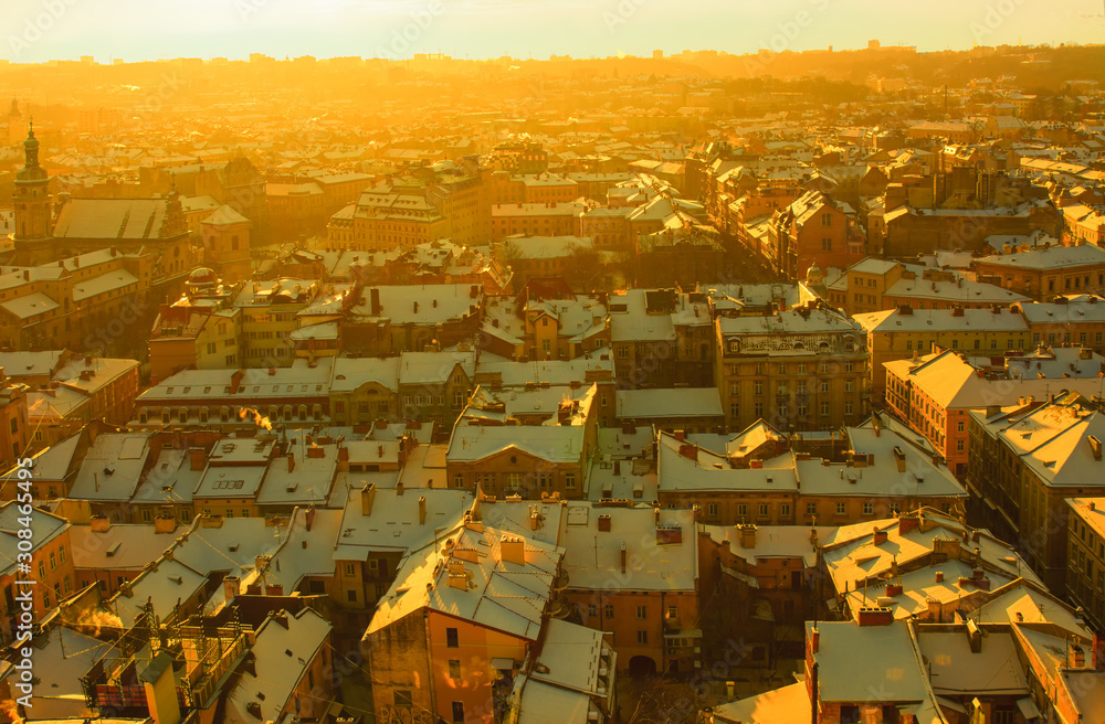 Panorama of the city in the rays of the setting sun. View from above. Roofs. Lviv. Ukraine.