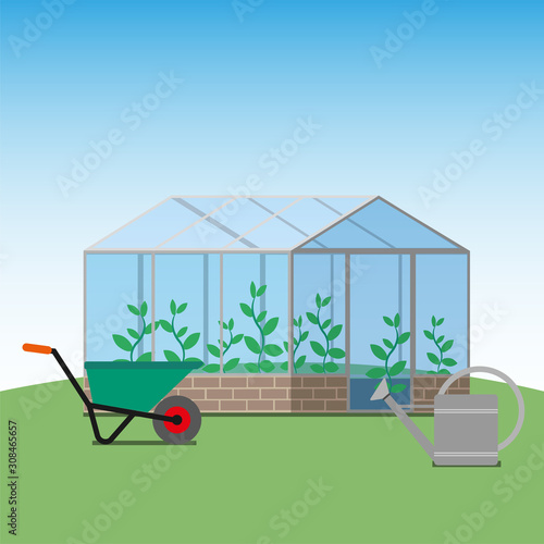 Greenhouse, wheelbarrow and water pitcher, gardening stuff. 