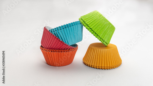 Wide shot of colorful cupcake wrappers stacked