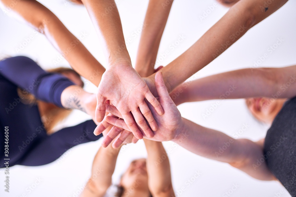 Young beautiful sportwomen doing gesture with hands Young beautiful sportwomen doing gesture with hands