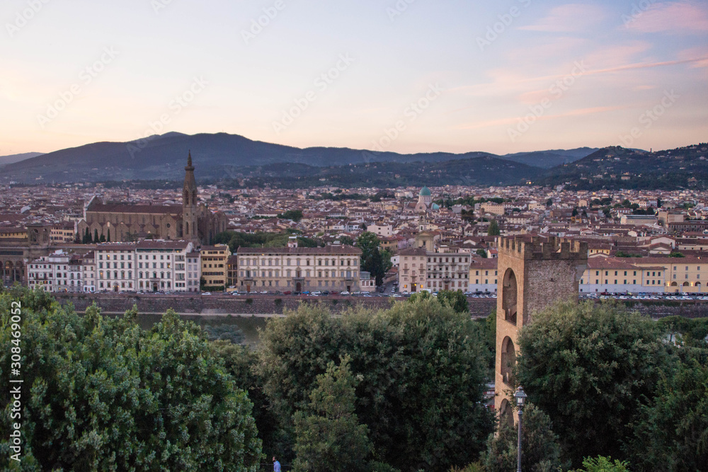 View over San Niccolò Tower and Basilica di Santa Croce at sunset. Piazzale Michelangelo, Florence, Italy. 