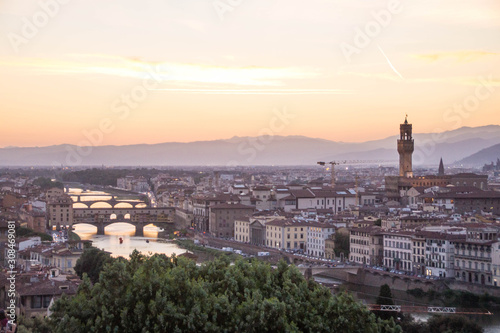 View over Arno river and Palazzo Vecchio tower at sunset. Piazzale Michelangelo, Florence, Italy.