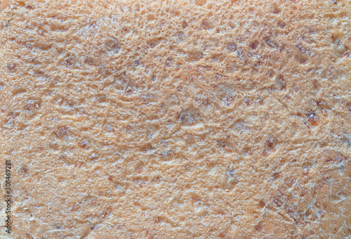 Close-up texture of brown whole wheat bread background abstract pattern. Detail texture of pattern with free space copy for text.