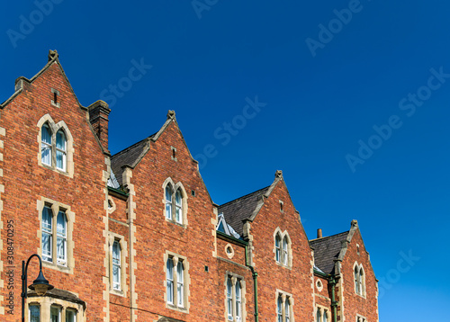 Row of traditional English red brick houses in York, Yorkshire.