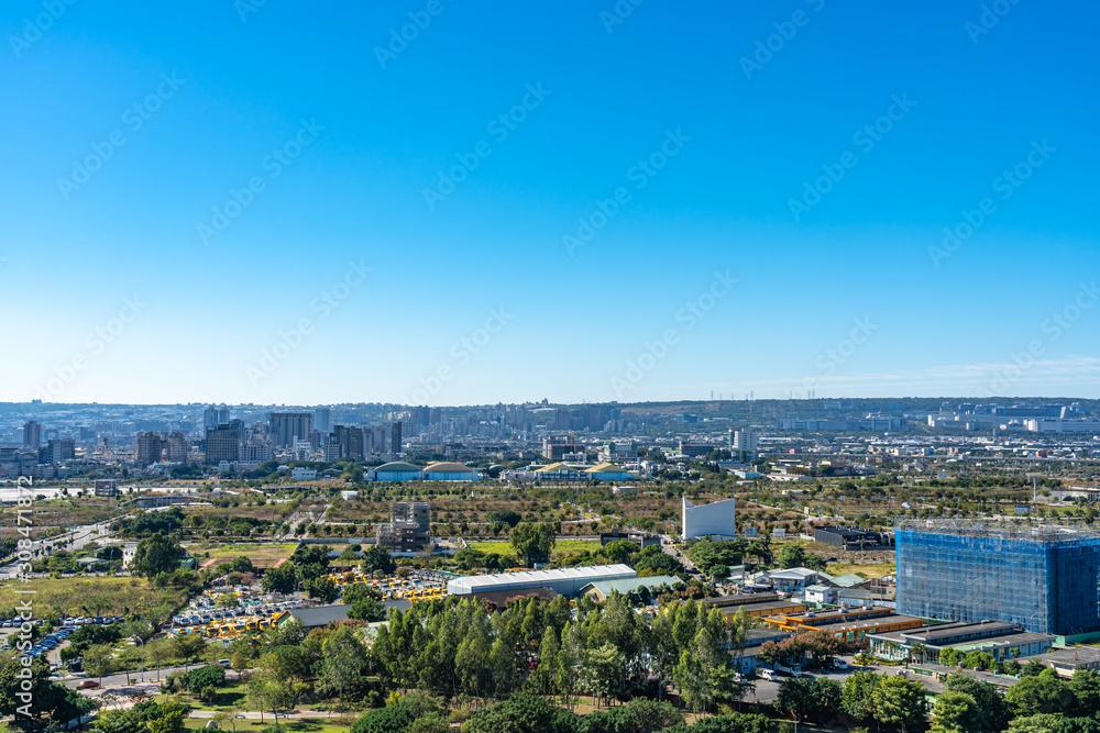 Taichung Central Park at the Shuinan Economic and Trade Park in sunny day with the city skyline. Taichung, Taiwan