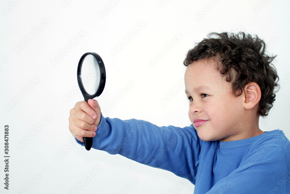boy with magnifying glass ready to explore on white background stock photo boy with magnifying glass ready to explore on white background stock photo