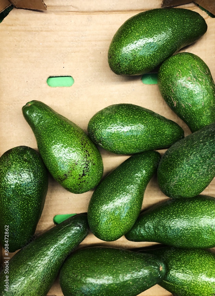 Delicious fresh avocado on the market view Delicious fresh avocado on the market view
