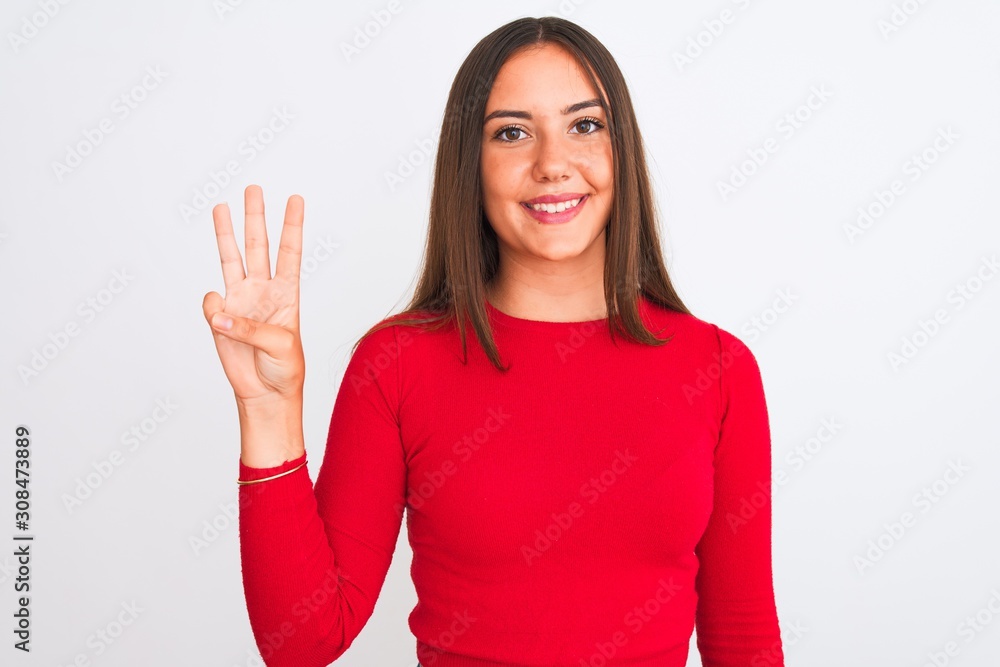 Young beautiful girl wearing red casual t-shirt standing over isolated white background showing and pointing up with fingers number three while smiling confident and happy. Young beautiful girl wearing red casual t-shirt standing over isolated white background showing and pointing up with fingers number three while smiling confident and happy.