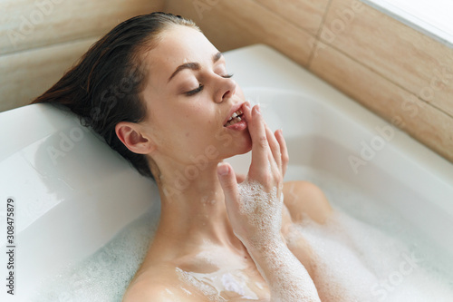 young woman taking a bath