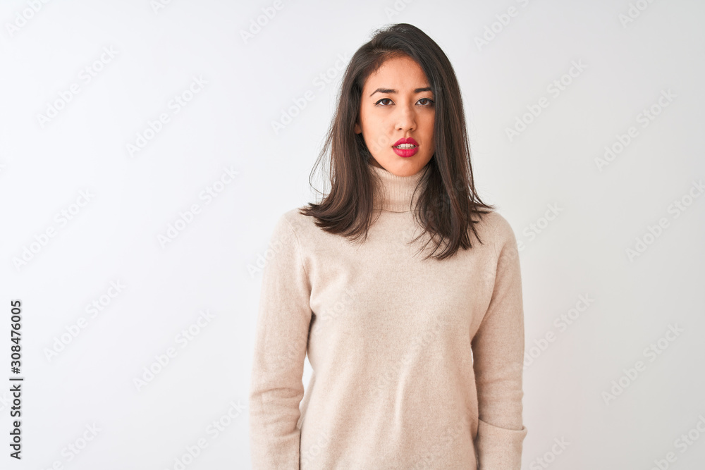 Beautiful chinese woman wearing turtleneck sweater standing over isolated white background looking sleepy and tired, exhausted for fatigue and hangover, lazy eyes in the morning. Beautiful chinese woman wearing turtleneck sweater standing over isolated white background looking sleepy and tired, exhausted for fatigue and hangover, lazy eyes in the morning.