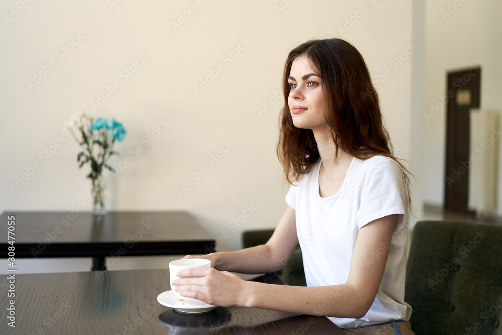 woman sitting on sofa and using laptop woman sitting on sofa and using laptop