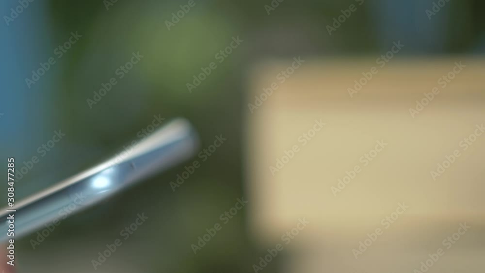Extreme close up of a girl’s hands browsing a smartphone Extreme close up of a girl’s hands browsing a smartphone