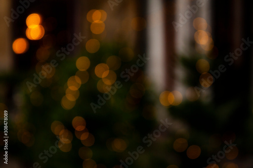 blurry lights of garlands on Christmas trees